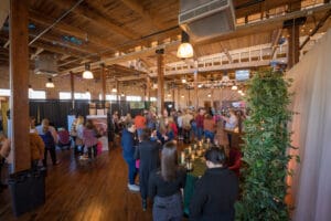 A groups of peoples are standing in the exhibition hall