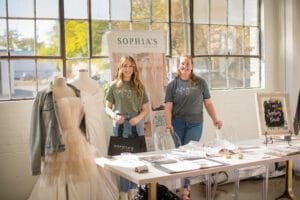 2 women running a fashion stall