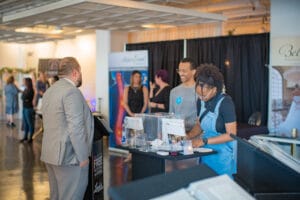 2 people running a stall in the event