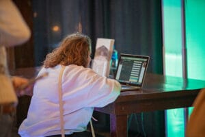 A women doing a some work in the laptop