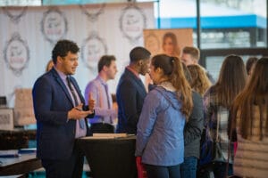 A man talking a women in the event