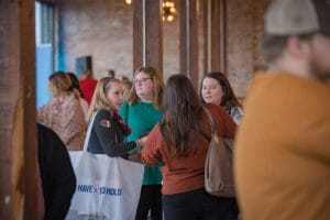 A Group of women discussing in the event