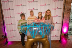 A Group of women is talking photo with a ring shape ballon