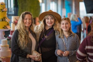 3 women talking photo in the event