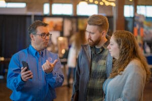 A Advisor talking to a people in the event